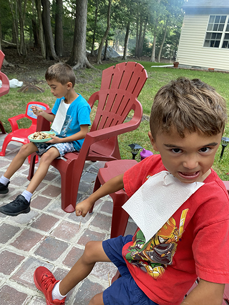 Nephews at the firepit in the backyard